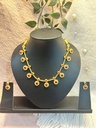 Golden Kundan Floral Necklace – Red Elegance